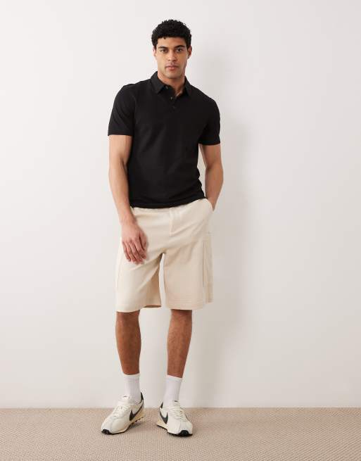 Mango – Kurzärmliges Polo-Oberteil aus Jersey in Schwarz mit Knopfleiste, 2 von 5