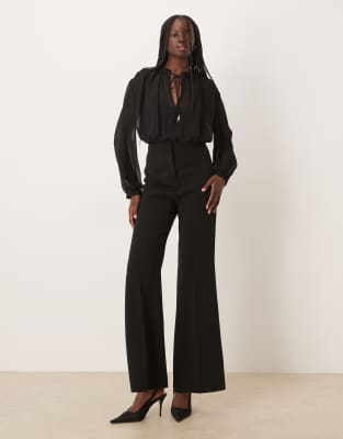 Mango - Langärmliger Jumpsuit in Schwarz mit Raffung