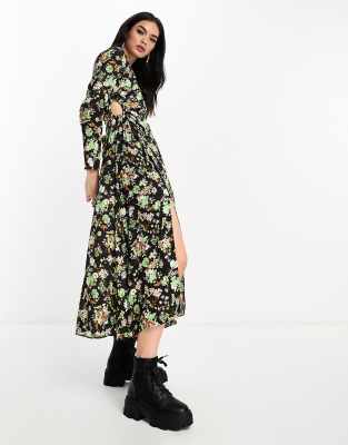 Mango - Langärmliges Kleid in Grün und Schwarz mit seitlichem Schlitz, Blumenmuster und Schlüssellochausschnitt an der S...