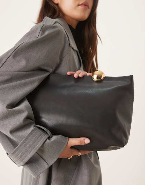Mango large clutch bag with gold accent fastening in black - view 1