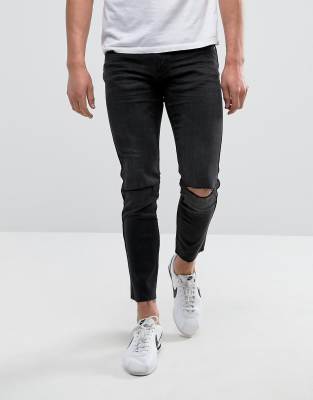 black jeans with holes in knees