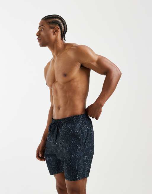 Mango – Marinblå, blommiga badshorts, 4 av 5