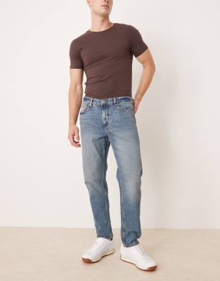 Mango – Mörkblå avsmalnande jeans med tvättad finish - view 1