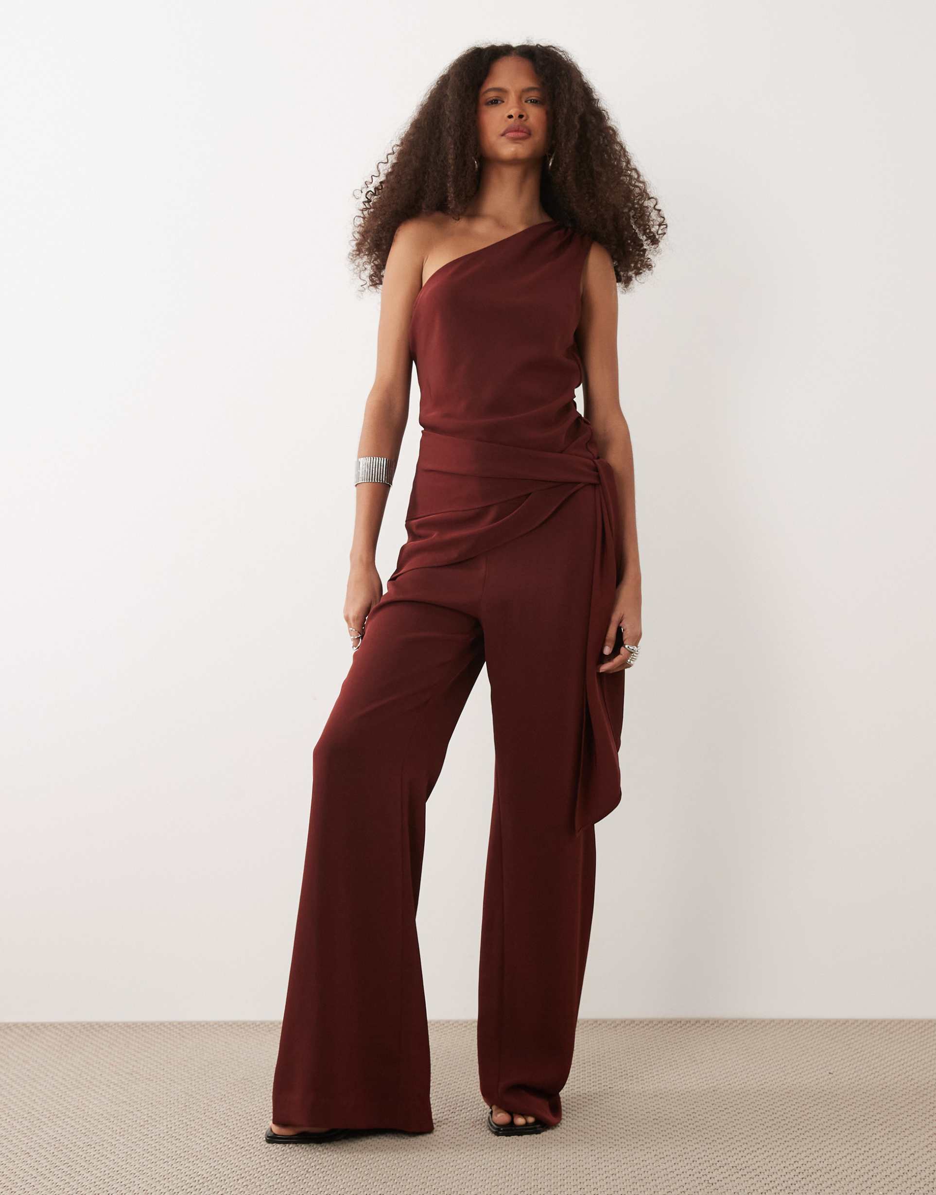mango one shoulder tie waist jumpsuit in deep red