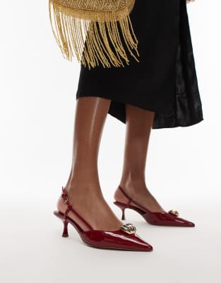 pointed heels with gold detailing in red