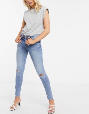 blue ripped knee jeans