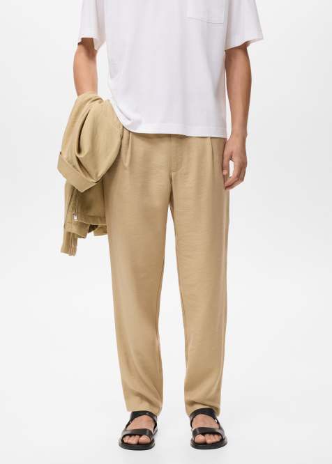 Mango – Schmal zulaufende Hose in Beige mit elastischem Bund - view 1