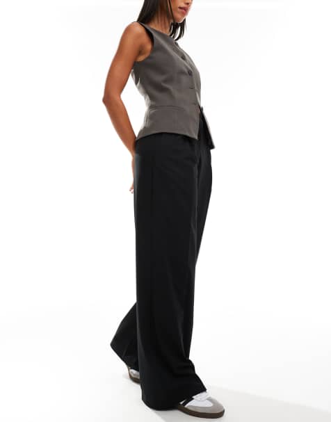 Mango slouchy mid waist trousers in black - view 1