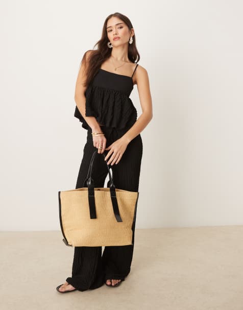 Mango – Svart set i broderie anglaise med linne i peplum-modell och raka byxor - view 1