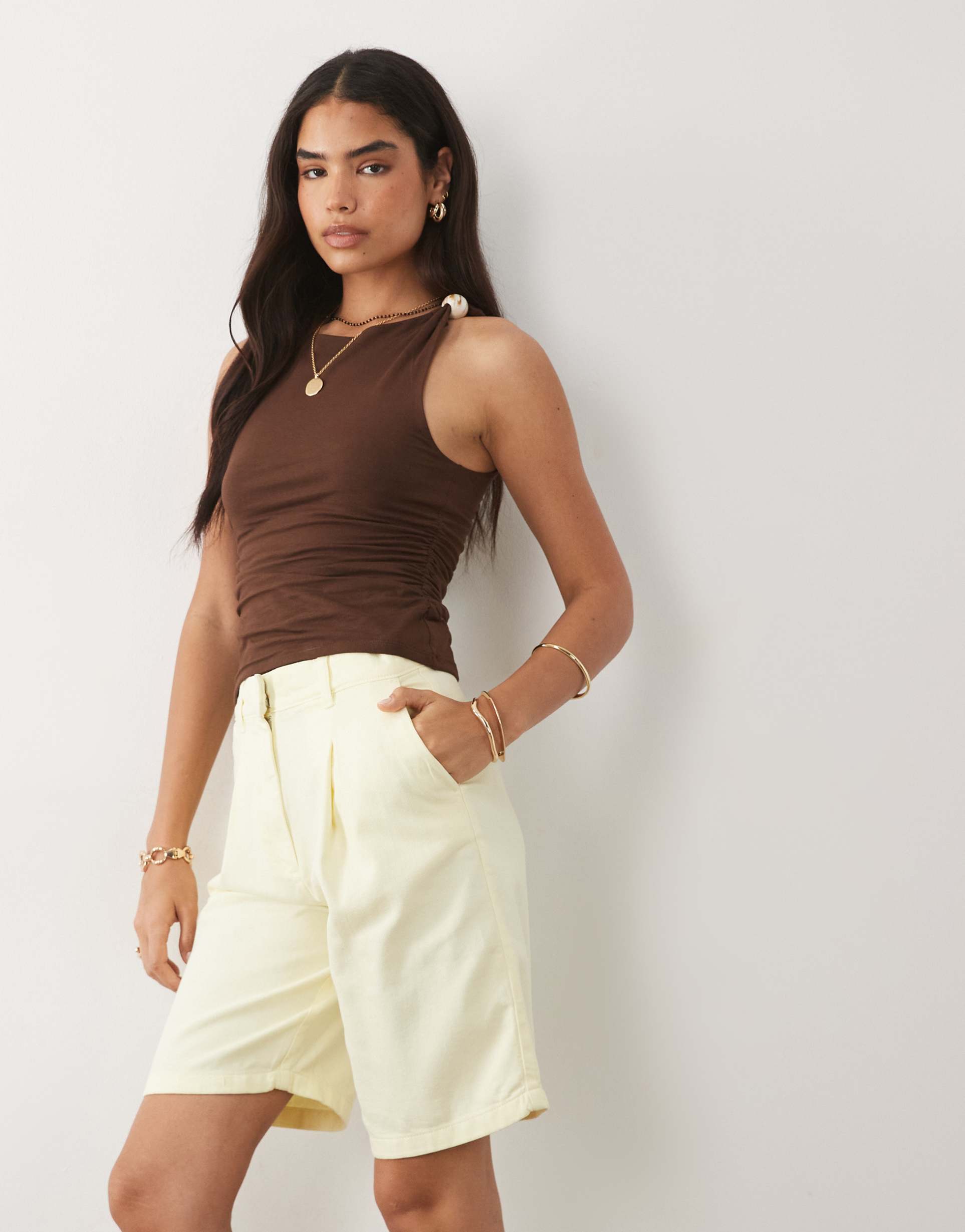 mango tailored bermuda shorts in pastel yellow