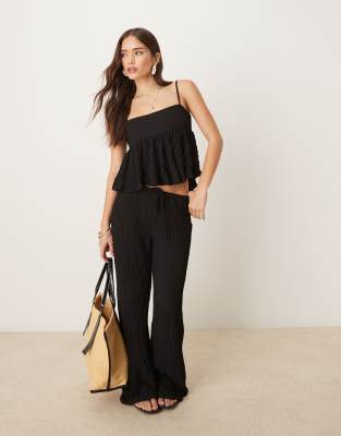 textured straight leg pants in black - part of a set