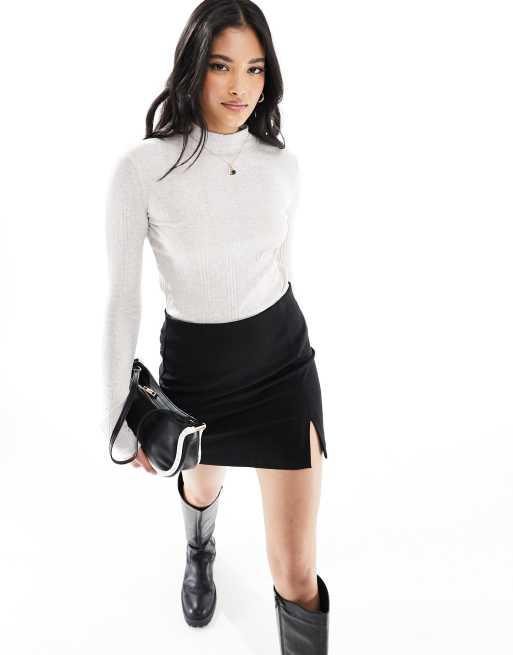 Mango - Top met geribbeld detail en hoge hals in wit