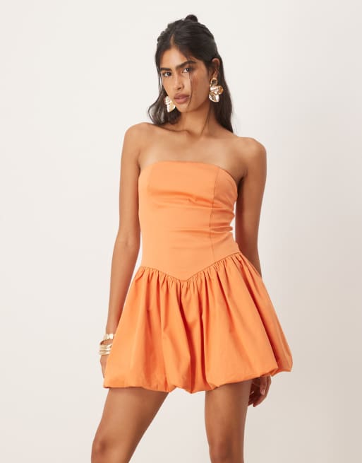 Mango – Trägerloses Minikleid aus orangefarbenem Baumwollmix mit tiefer Taille und Ballonsaum