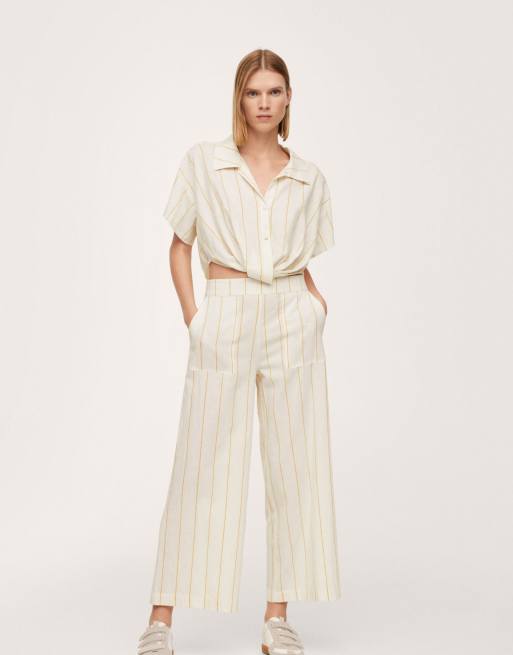 Mango – Vitrandig jumpsuit i linne med utskurna detaljer