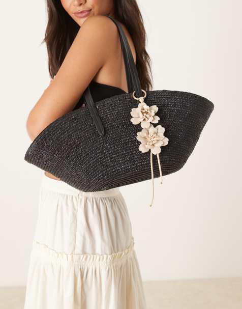 Mango woven straw bag with flower charm in black - view 1
