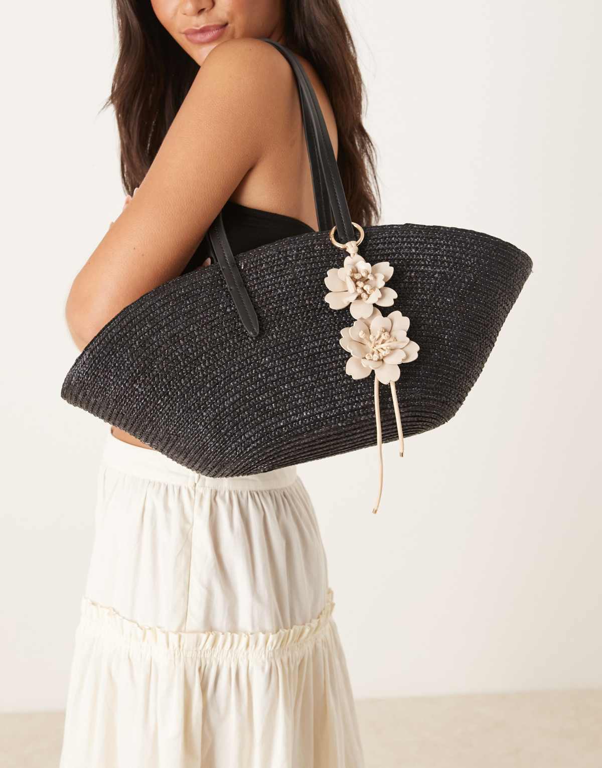 Mango woven straw bag with flower charm in black