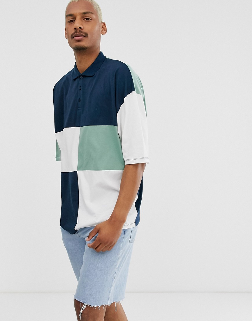Marineblå oversized longline poloskjorte med halvlange ærmer og patchwork-farveblokke fra ASOS DESIGN