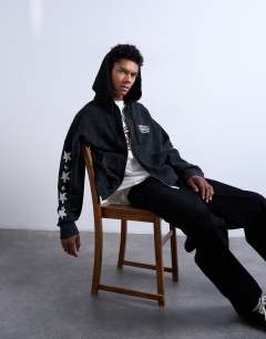 Model wearing Mason Newman x Topman boxy fit hoodie with cowgirl front and back print in washed black