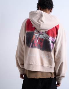 Model wearing Mason Newman x Topman boxy fit hoodie with hotel bar front and back print in washed stone