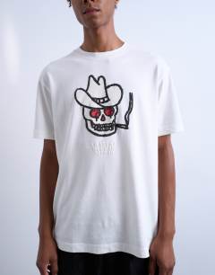 Model wearing Mason Newman x Topman oversized fit t-shirt with cowboy skull print in ecru