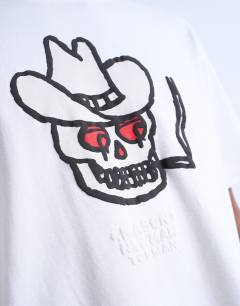 Model wearing Mason Newman x Topman oversized fit t-shirt with cowboy skull print in ecru