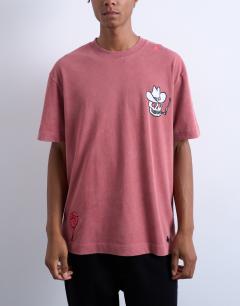 Model wearing Mason Newman x Topman oversized fit t-shirt with placement embroidery in washed pink
