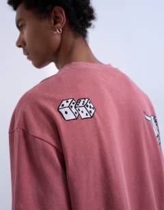 Model wearing Mason Newman x Topman oversized fit t-shirt with placement embroidery in washed pink