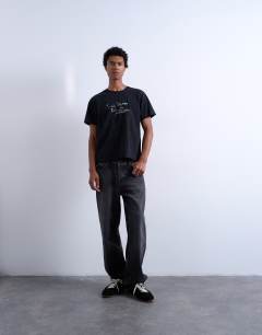 Model wearing Mason Newman x Topman regular fit t-shirt with till death do us part front and back print in washed black