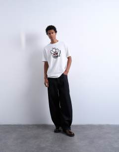 Model wearing Mason Newman x Topman relaxed fit t-shirt with cowboy skull print in ecru