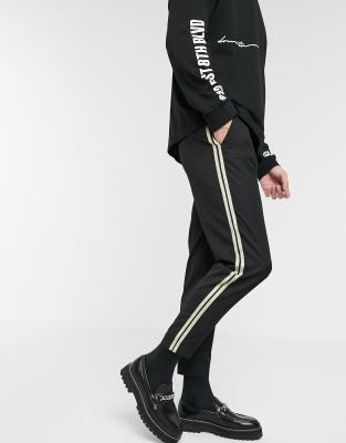 black pants with gold stripe