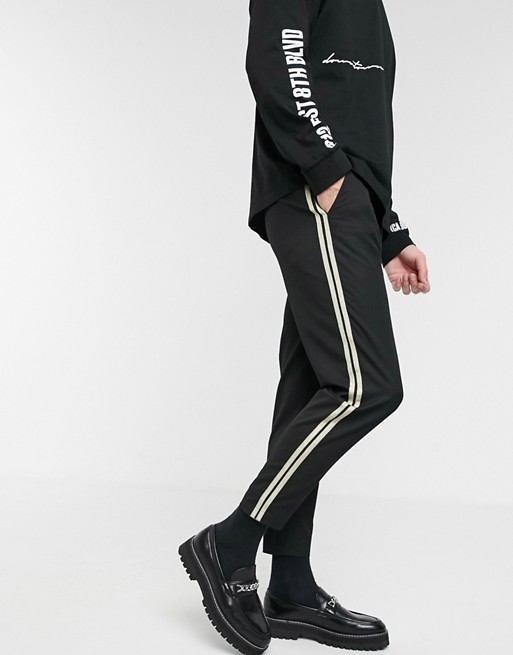 Mauvais cropped trousers with gold side stripe in black