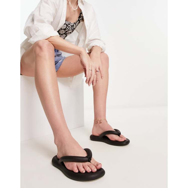 Melissa chunky bubble flip flops in black ASOS