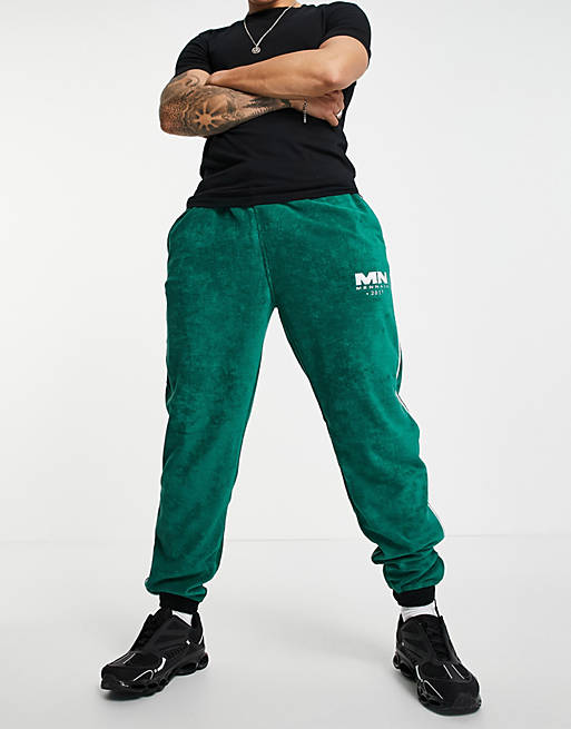 Mennace joggers co-ord in green towelling with side stripe and zipped hem