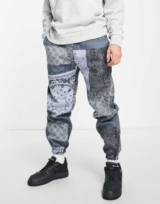 Mennace - Joggingbroek met patchwork paisley motief in blauw, deel van co-ord set