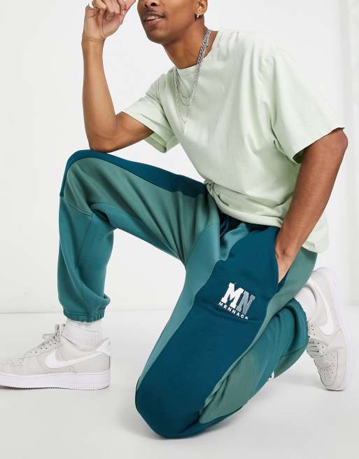 Mennace – Jogginghose mit geteiltem Design in Tannengrün, Kombiteil