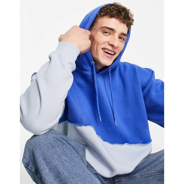 Mennace relaxed hoodie in two tone blue with exposed seam detail