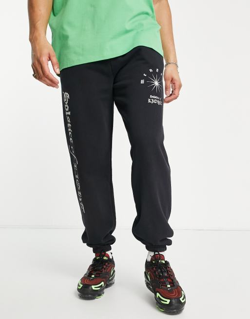 Mennace trackies in washed black with placement print (Part of a set)