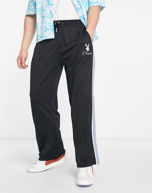 Mennace x Playboy straight leg sweatpants in black with blue side stripe and split hem