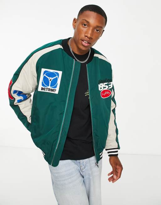 Mennace varsity bomber jacket in forest green with multiple badges and  monogram sleeves