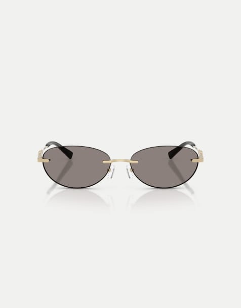 Michael Kors Manchester oval sunglasses with grey lens in light gold shiny - view 1
