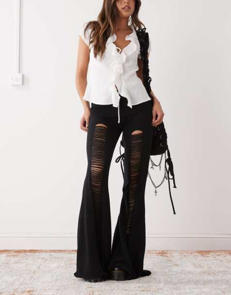 Minga London distressed folded knit flare trouser in black - view 1