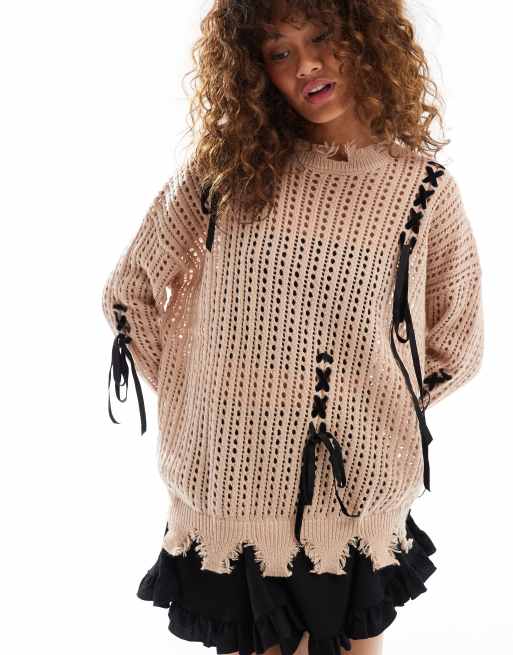 Minga London open knit grunge jumper with black bows in beige