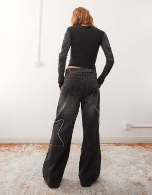Minga London Washed Distressed Baggy Jeans With Star Graphic In Black