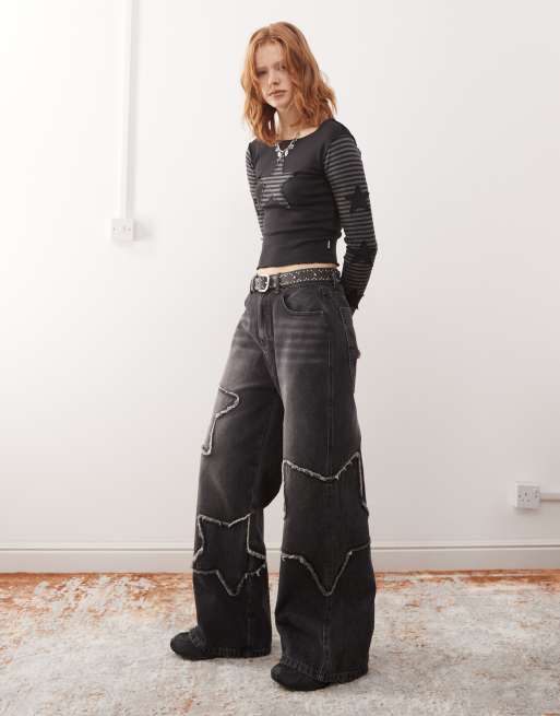 Minga London washed distressed baggy jeans with star graphic in