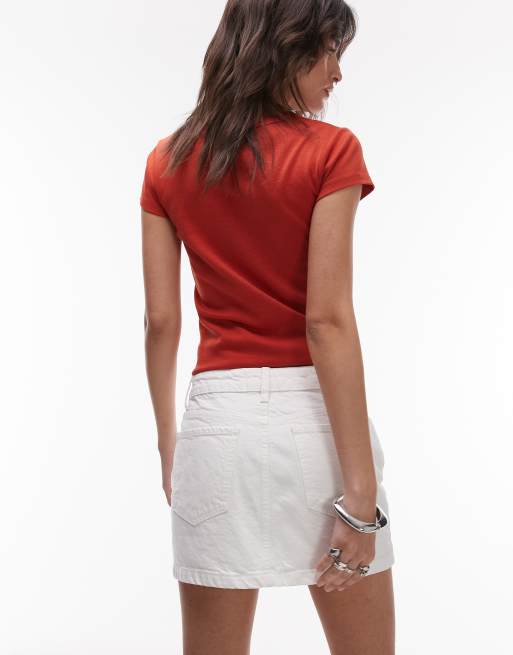 Minifalda muy corta vaquera color hueso de Topshop
