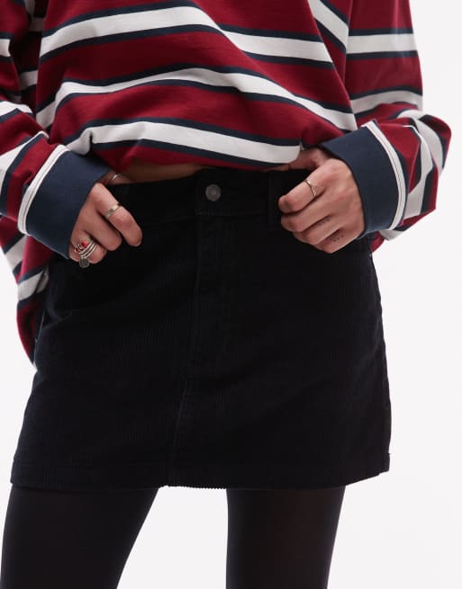 Minifalda muy corta vaquera negra de pana de Topshop