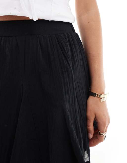 Minifalda negra con diseño de godets de algodón de ASOS DESIGN, 5 de 5