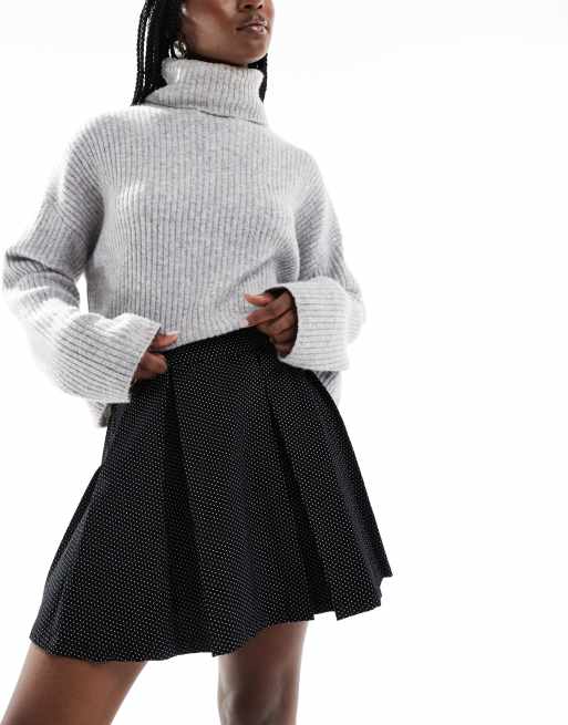 Minifalda negra plisada con estampado de lunares de pana de Wednesday's Girl