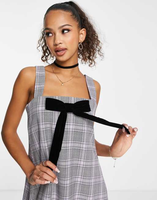 Miss Selfridge babydoll bow detail mini pinny dress in check | ASOS