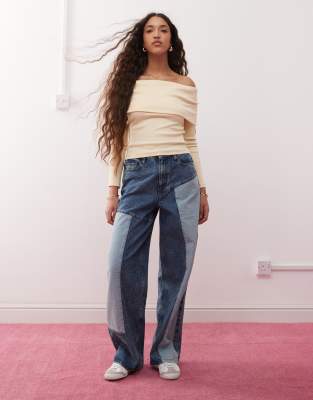 Miss Selfridge - Baggy-Jeans aus Denim in blauer Waschung mit Aufnähern